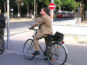 Cycling to work. "Urban cycling III". Licensed under Public Domain via Wikimedia Commons - https://commons.wikimedia.org/wiki/File:Urban_cycling_III.jpg#/media/File:Urban_cycling_III.jpg