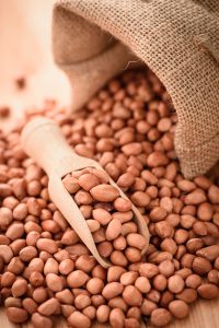 45135922 - close up of raw peanuts or arachis in wooden spoon