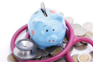 22722908 - blue piggy bank with stethoscope for check your finance