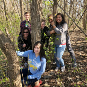 Promega employees enjoying the woods on campus