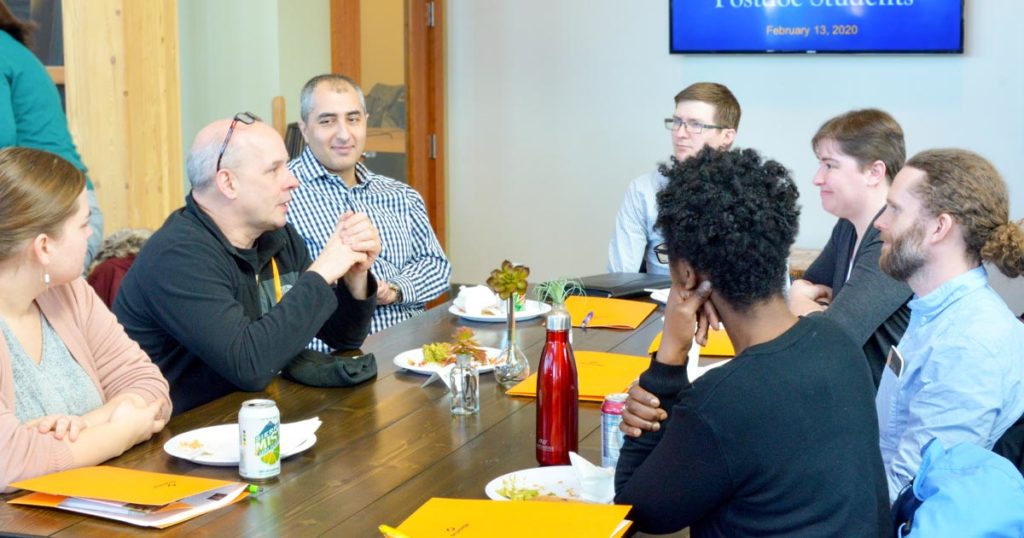 Promega employees and UW Post-Docs having lunch