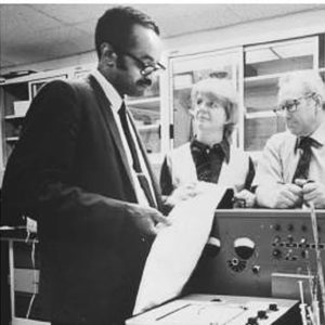 Image of Emmett Chappelle working with other scientists. 
