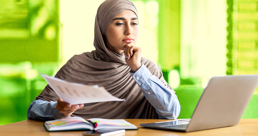 Young woman searching databases for findingscholarly articles.
