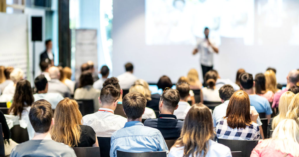 professionals at a workshop; writing successful grants requires understanding your audience