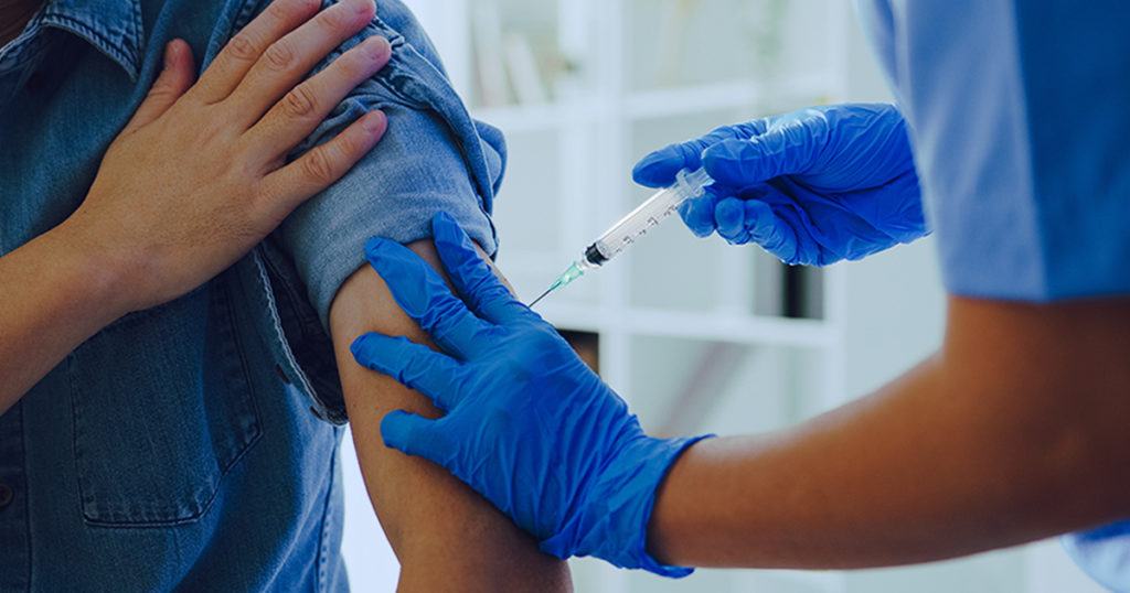 Person receiving a vaccine. Lynch syndrome, a hereditary condition that causes a predisposition to several types of cancer is an excellent target for preventative treatment. Read more about how researchers have recently explored vaccines for Lynch syndrome