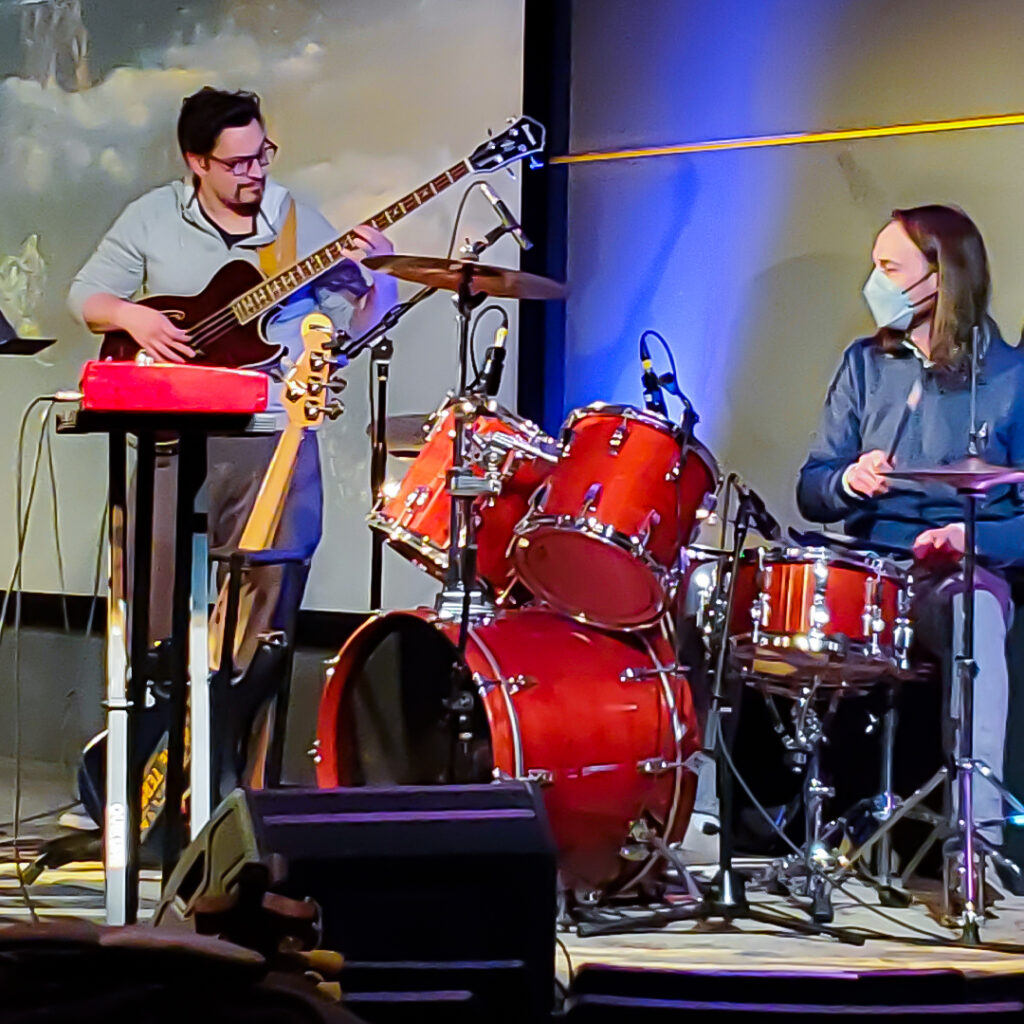 Two employees prepare for a Major Groove performance