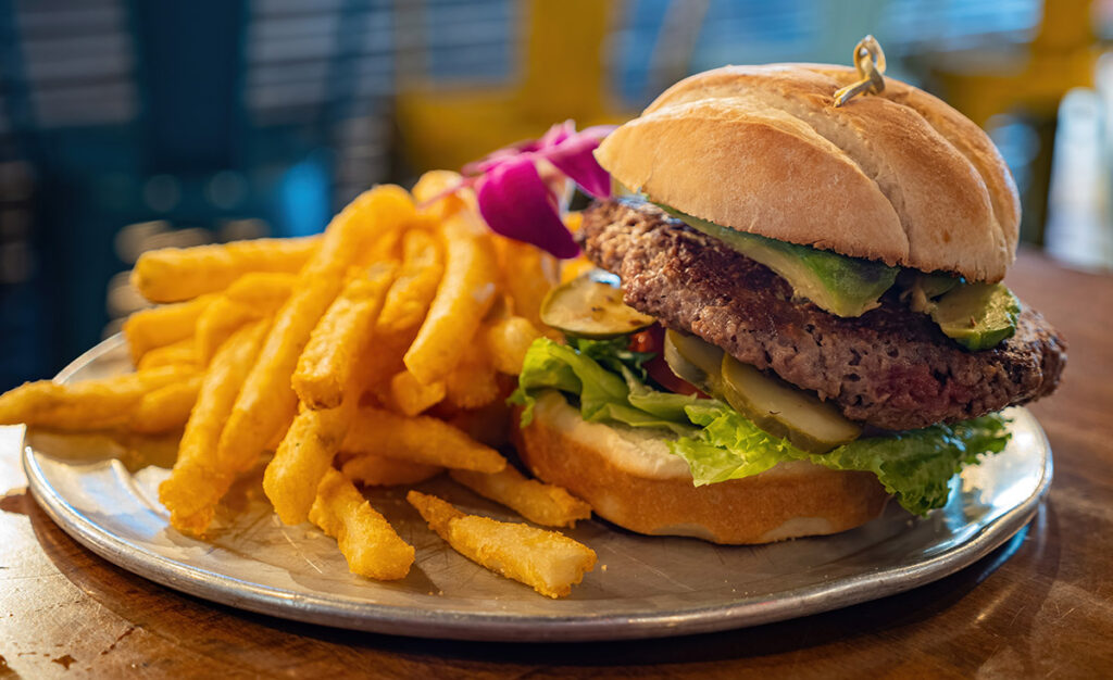 An Impossible Burger served with fries on the side